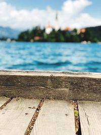 Close-up of pier over sea against sky