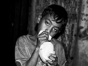 Portrait of boy eating