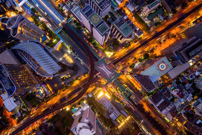 High angle view of illuminated city street at night