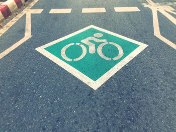 High angle view of road sign on street
