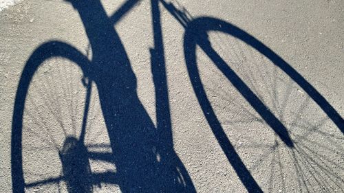 Shadow of bicycle on street