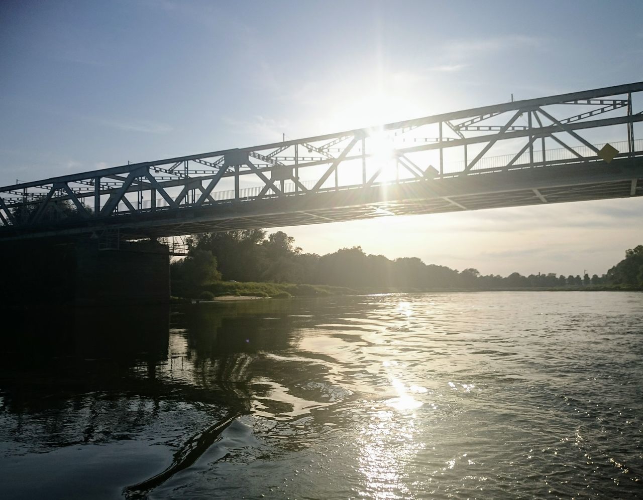 Bridge - Man Made Structure Connection Built Structure Business Finance And Industry Sunlight Transportation Water Travel Destinations River Architecture Steel Low Angle View Sky Outdoors Landscape History Day Summer Silhouette Scenics