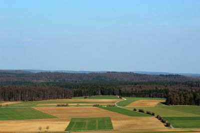 High angle view of golf course against clear sky