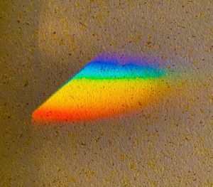 High angle view of multi colored umbrella on sand