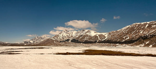 Idyllic shot of snowcapped mountains against sky