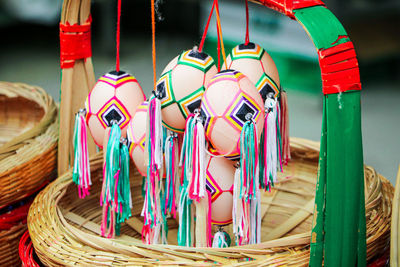 Close-up of multi colored decorations hanging at market stall