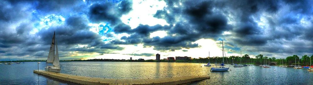 View of harbor against cloudy sky