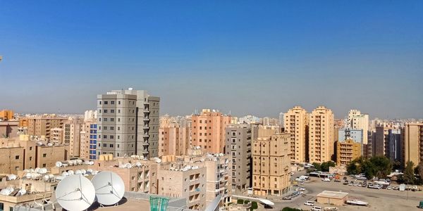 High angle view of buildings against clear sky