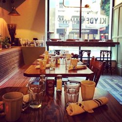 Empty chairs and tables in restaurant