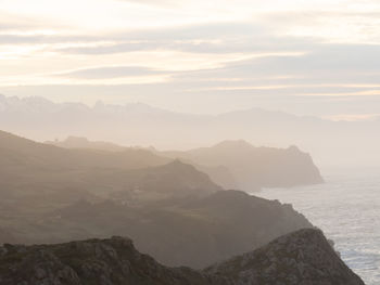 Scenic view of misty cliffs