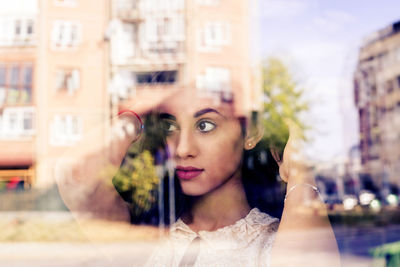 Portrait of young woman looking away