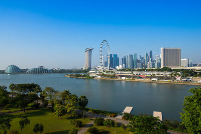 City by sea against clear blue sky