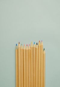 Close-up of colored pencils against white background