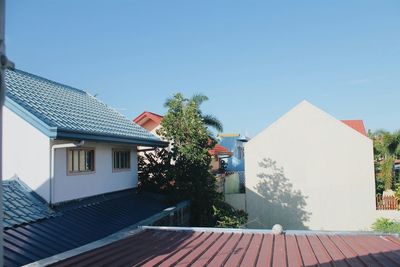 Buildings against blue sky and clouds