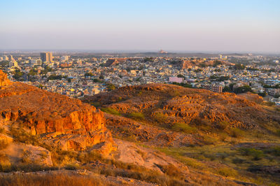 High angle view of buildings in city against sky