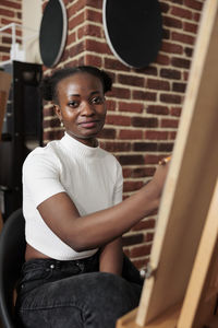 Young man sitting on chair