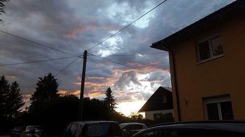 Low angle view of road against cloudy sky