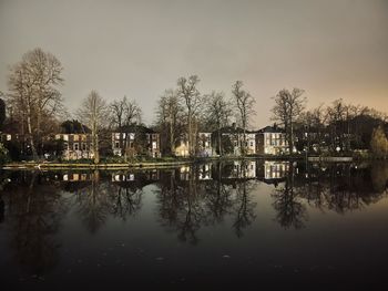 Reflection of trees in lake against sky