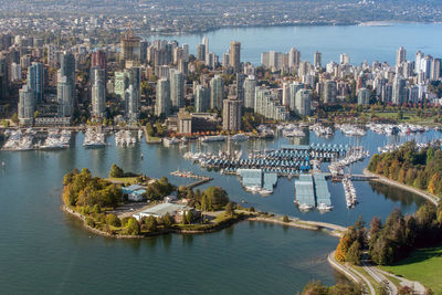 High angle view of bay and buildings against sky