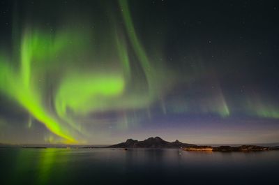 Panoramic view of landegode with aurora borealis