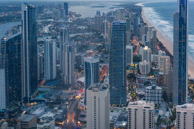 Aerial cityscape with futuristic skyscrapers at dusk. modern city skyline view