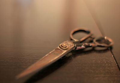 Close-up of scissors on table