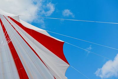 Low angle view of flag against blue sky