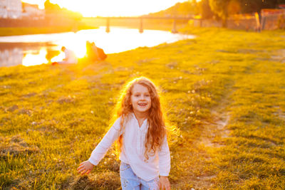 Portrait of smiling woman on field