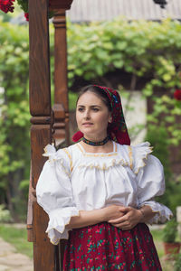 Portrait of woman standing outdoors