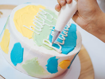 Close-up of hand holding ice cream