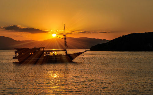 Scenic view of sea against orange sky