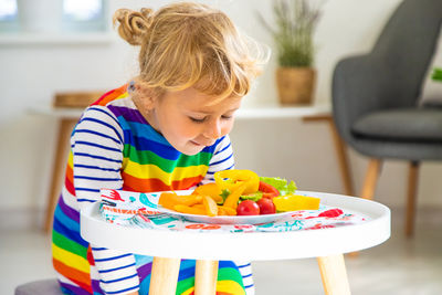 Close-up of boy playing with toys at home