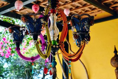 Low angle view of multi colored decorations hanging at market