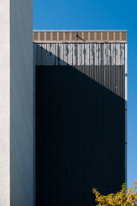 Low angle view of building against blue sky