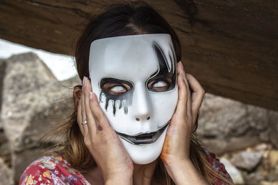 Close-up portrait of woman wearing mask