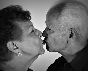 Close-up of senior man and woman kissing