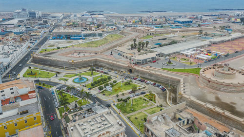 High angle view of road by buildings in city