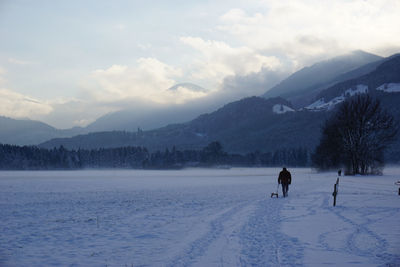 Scenic view of snow field against sky