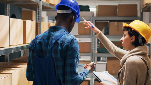 Side view of man working at construction site