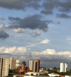 Buildings in city against sky