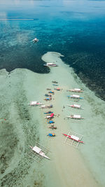 High angle view of boats in sea.  drone shot of boats ok a sandbar.