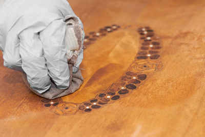 Close-up of man with tattoo on table