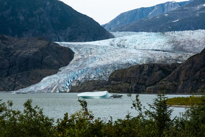 Scenic view of lake and mountains - mendenhall glacier 