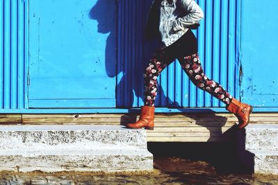 Low section of woman standing on steps