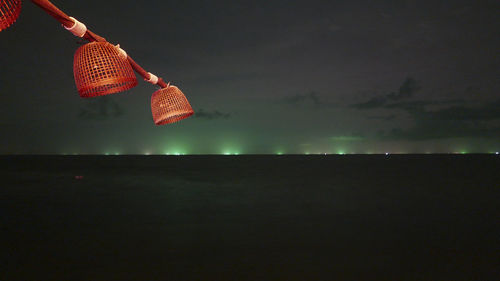 Clothes hanging against sky at night