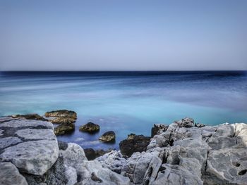 Scenic view of sea against clear sky