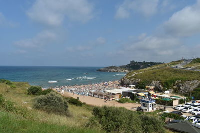 High angle view of sea and buildings against sky