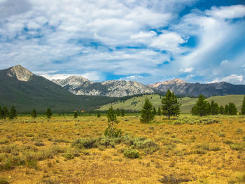 Scenic view of mountains against cloudy sky