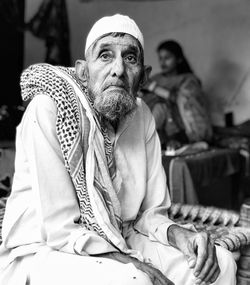 Portrait of man sitting outdoors