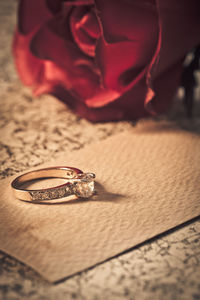 Close-up of wedding rings on table